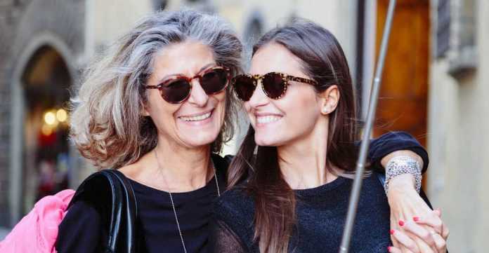 Mum and daughter taking photo with selfie stick